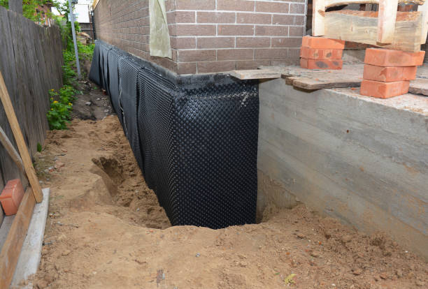 Happy homeowners after waterproofing job in Willis